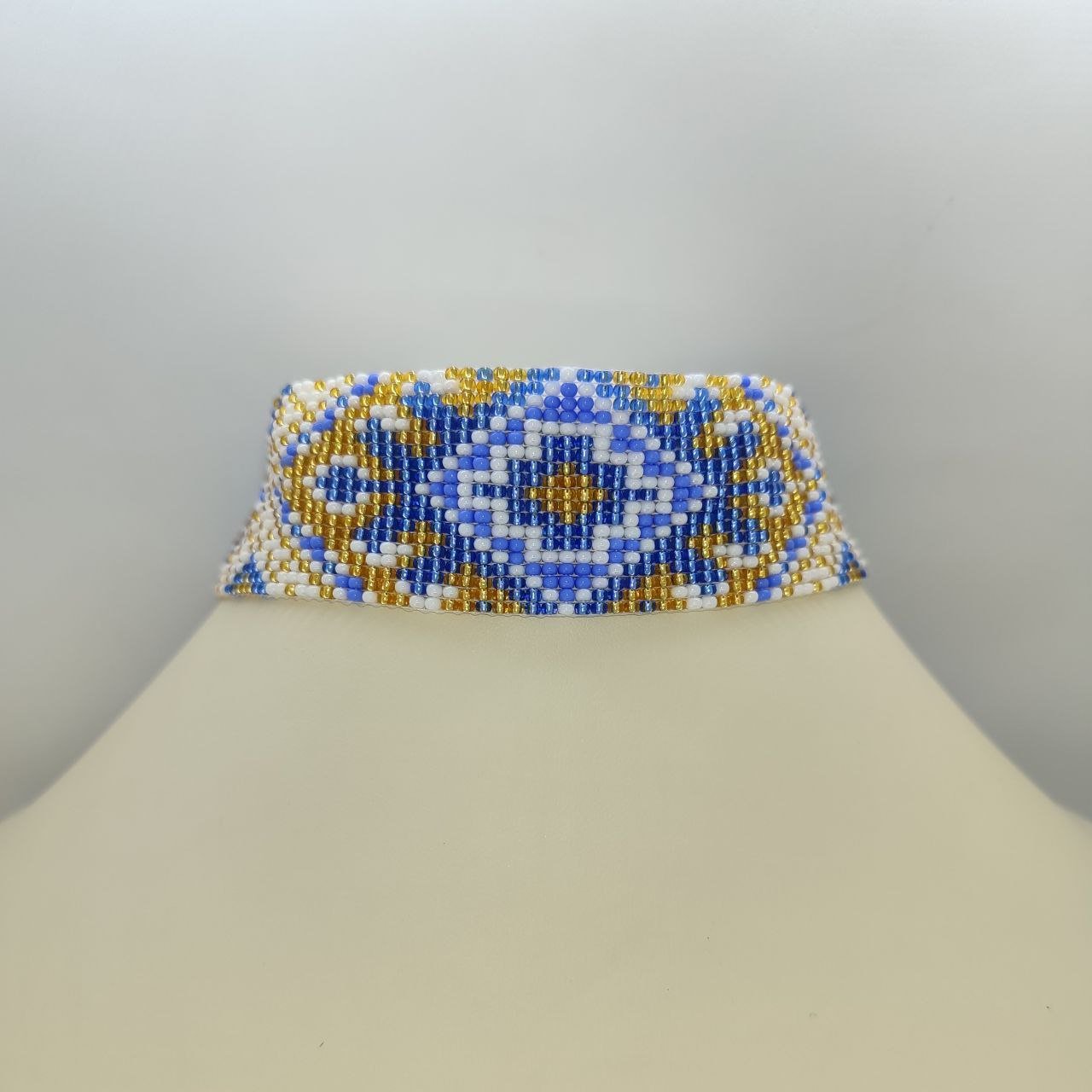 Блакитно-золотистий стрічковий гердан з орнаментом “Український”